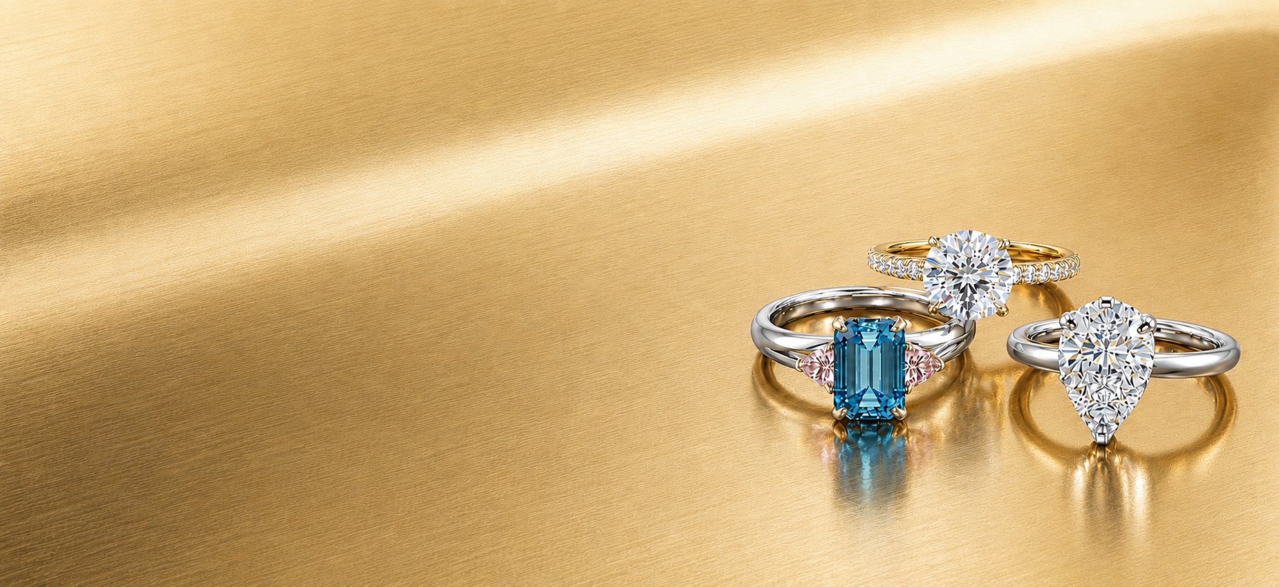 Two diamond rings on a gold background